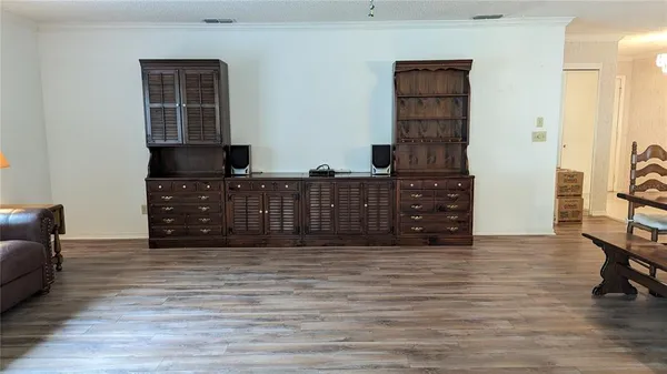 a view of wooden floor with windows
