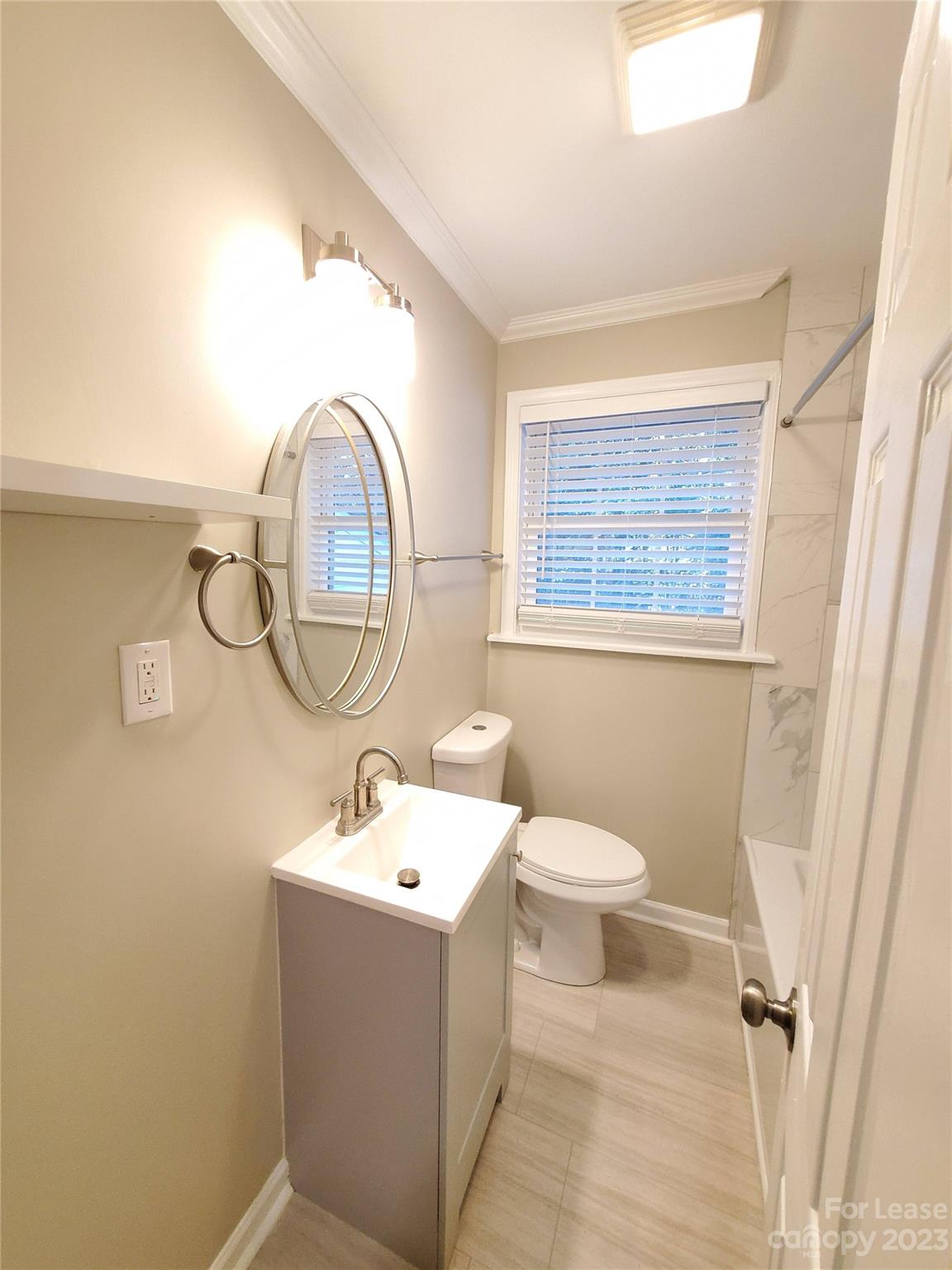 1545 Walton Road, Unit 1547 Charlotte, NC 28208 - Photo 12 of 25 a bathroom with a sink and a mirror