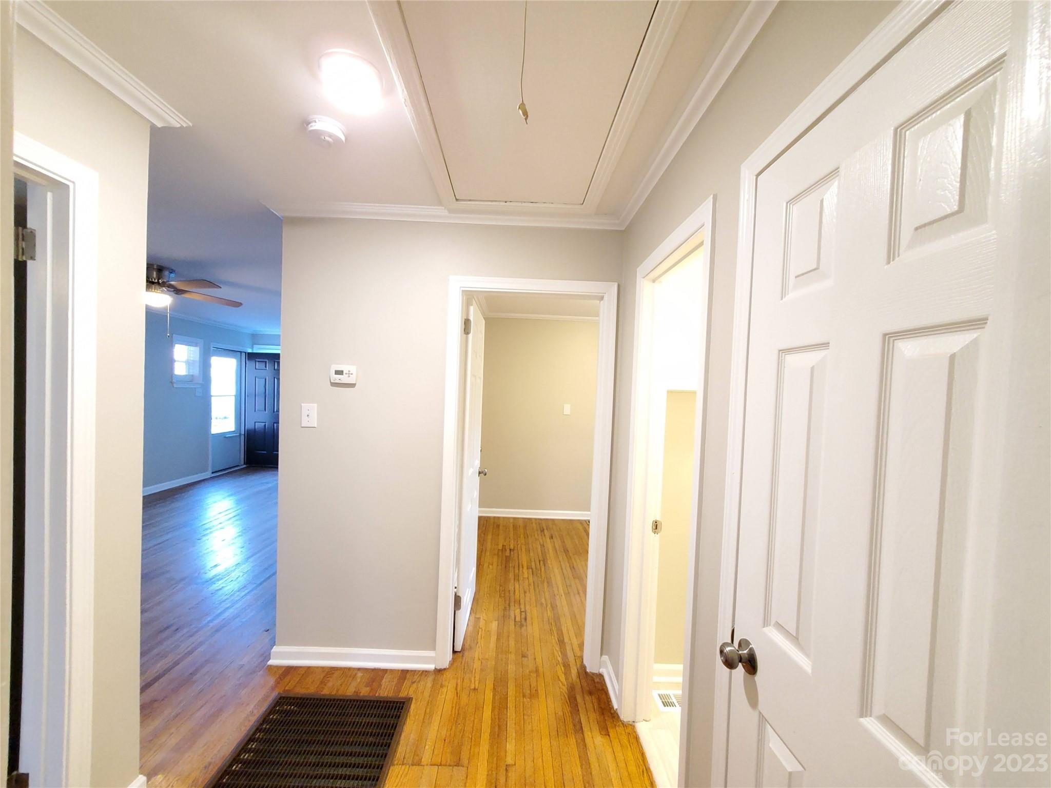 1545 Walton Road, Unit 1547 Charlotte, NC 28208 - Photo 14 of 25 a view of a hallway with wooden floor and staircase