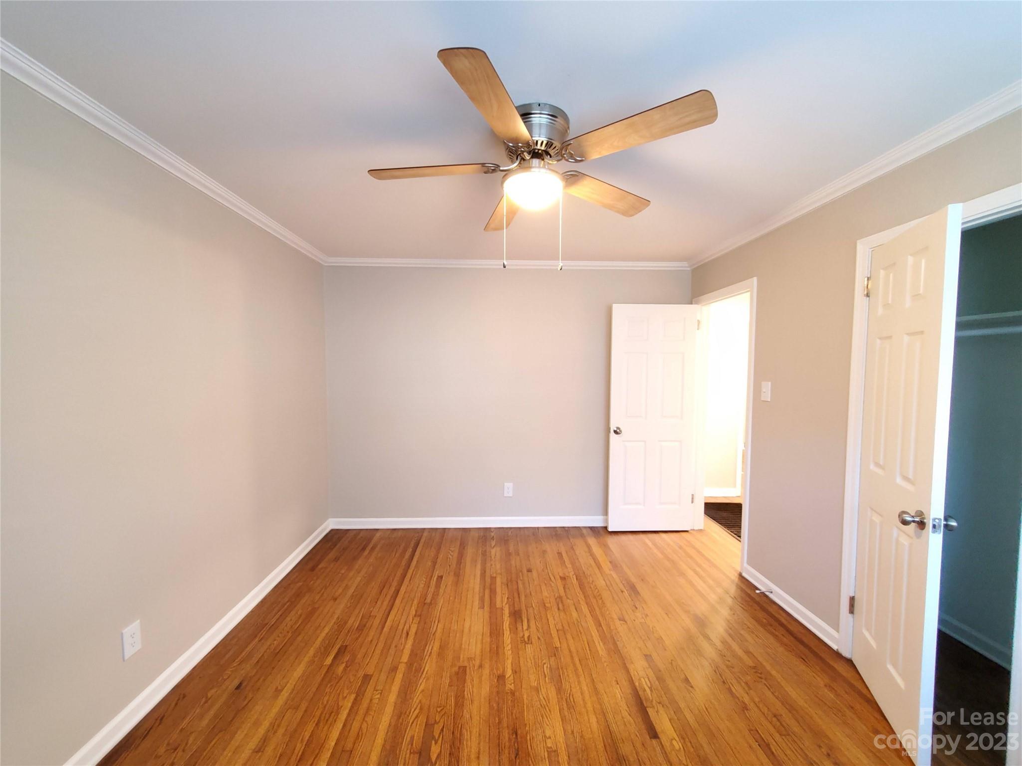 1545 Walton Road, Unit 1547 Charlotte, NC 28208 - Photo 19 of 25 wooden floor in an empty room