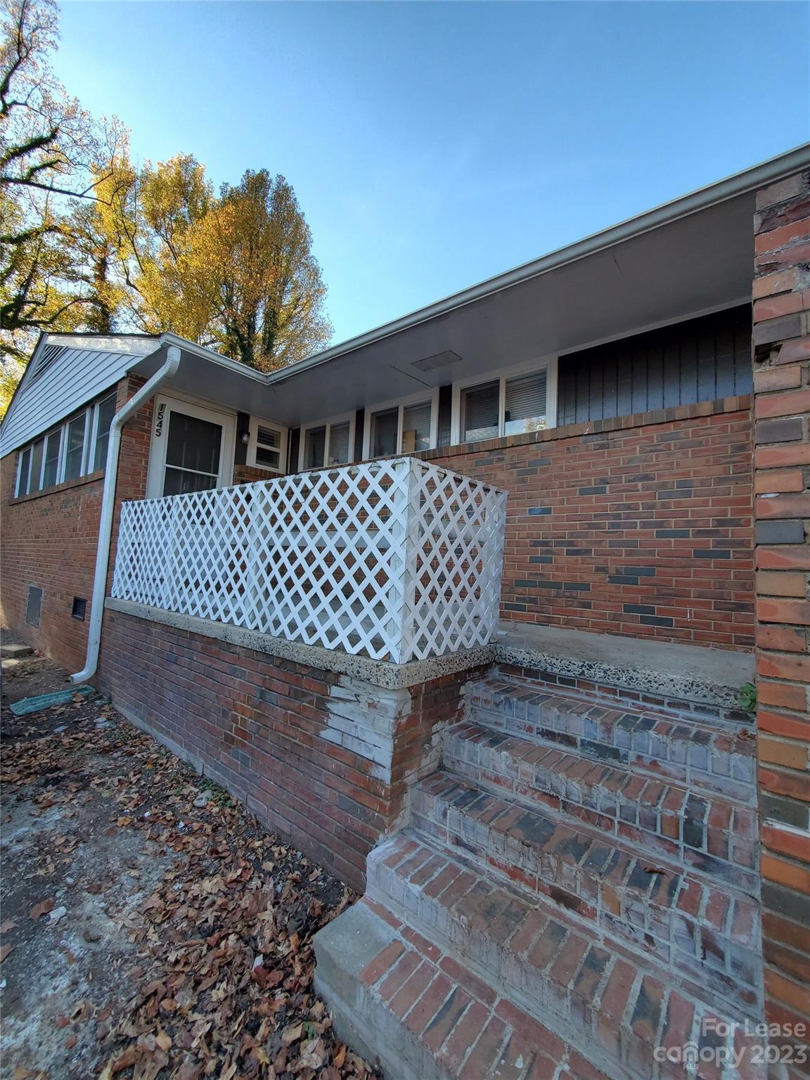 1545 Walton Road, Unit 1547 Charlotte, NC 28208 - Photo 2 of 25 a front view of a house with a yard