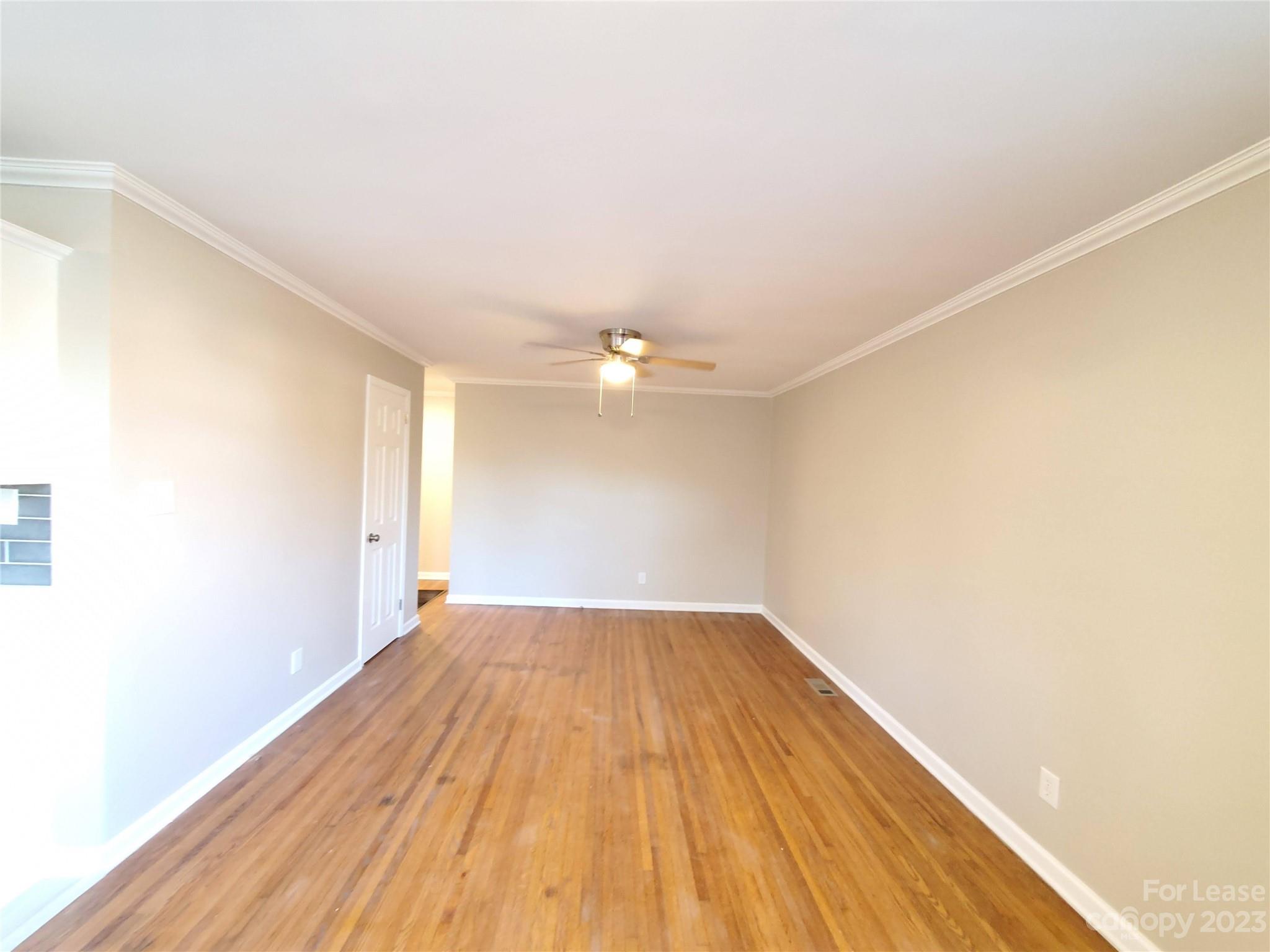 1545 Walton Road, Unit 1547 Charlotte, NC 28208 - Photo 21 of 25 a view of empty room with wooden floor