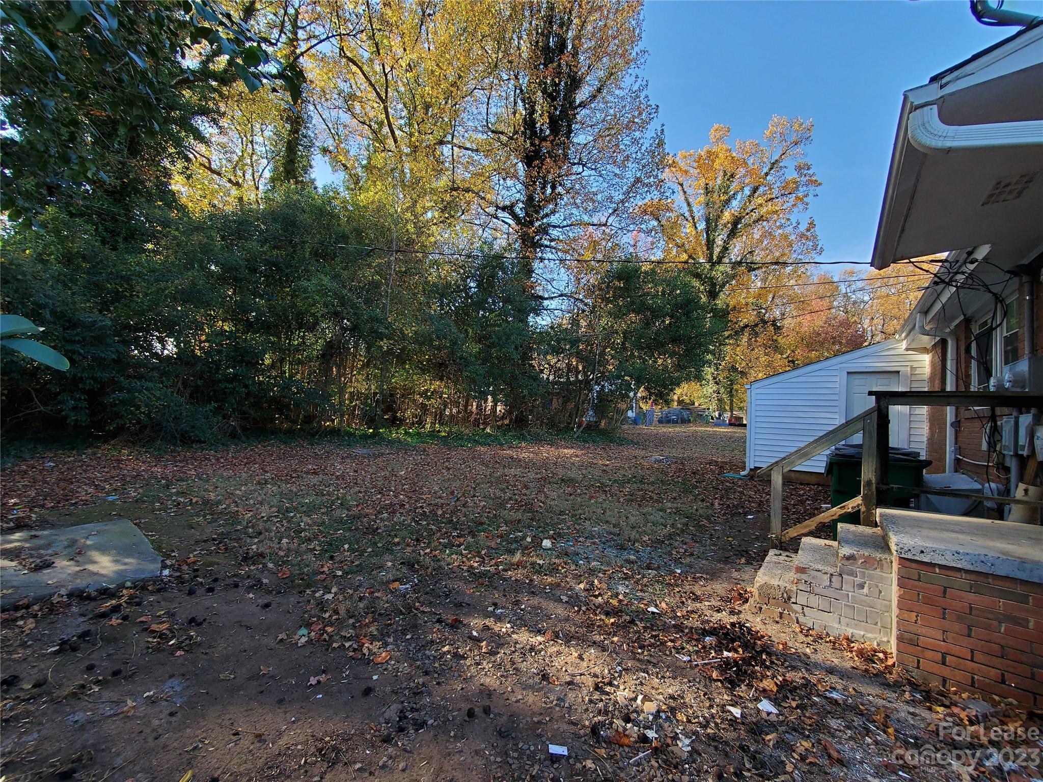 1545 Walton Road, Unit 1547 Charlotte, NC 28208 - Photo 24 of 25 a view of a yard with plants and trees