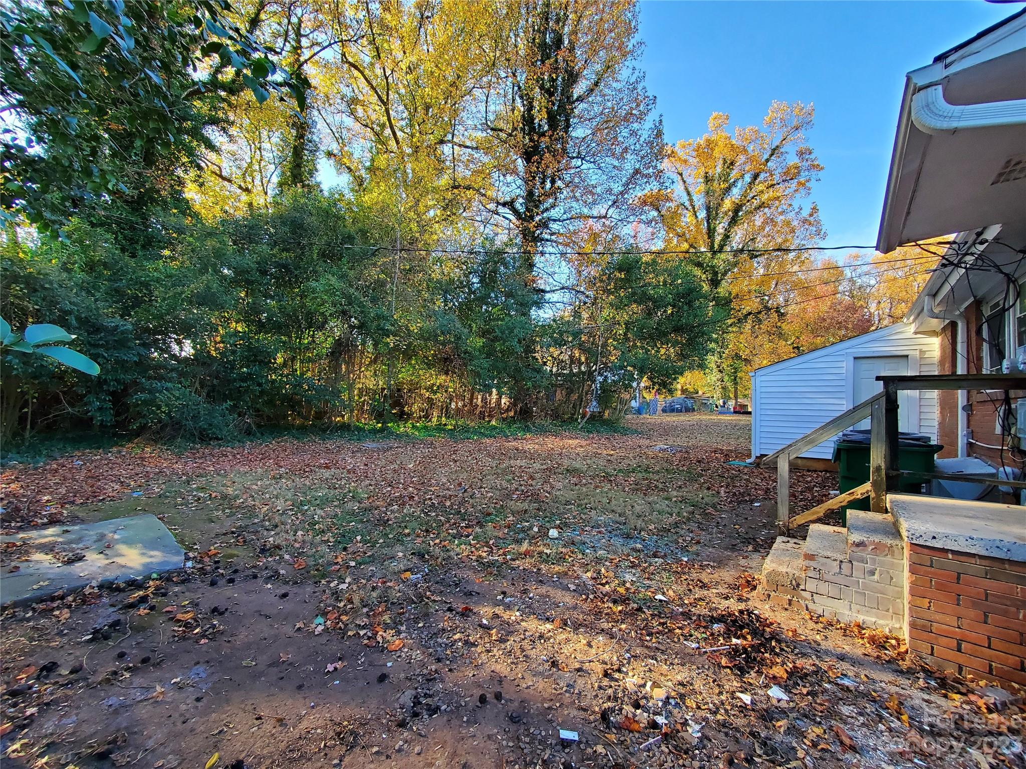 1545 Walton Road, Unit 1547 Charlotte, NC 28208 - Photo 25 of 25 a view of a yard with plants and trees