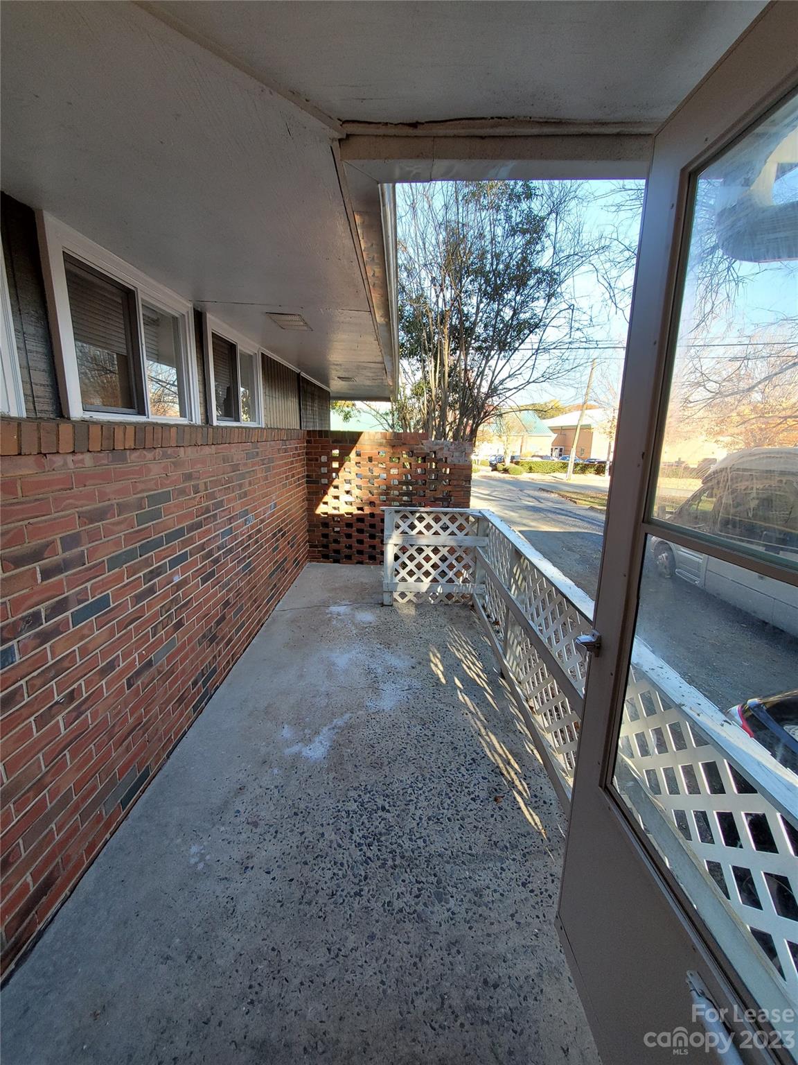 1545 Walton Road, Unit 1547 Charlotte, NC 28208 - Photo 3 of 25 a view of a porch with furniture and garden