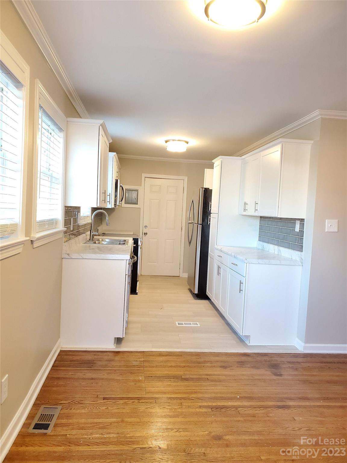 1545 Walton Road, Unit 1547 Charlotte, NC 28208 - Photo 5 of 25 a view of a kitchen with wooden floor