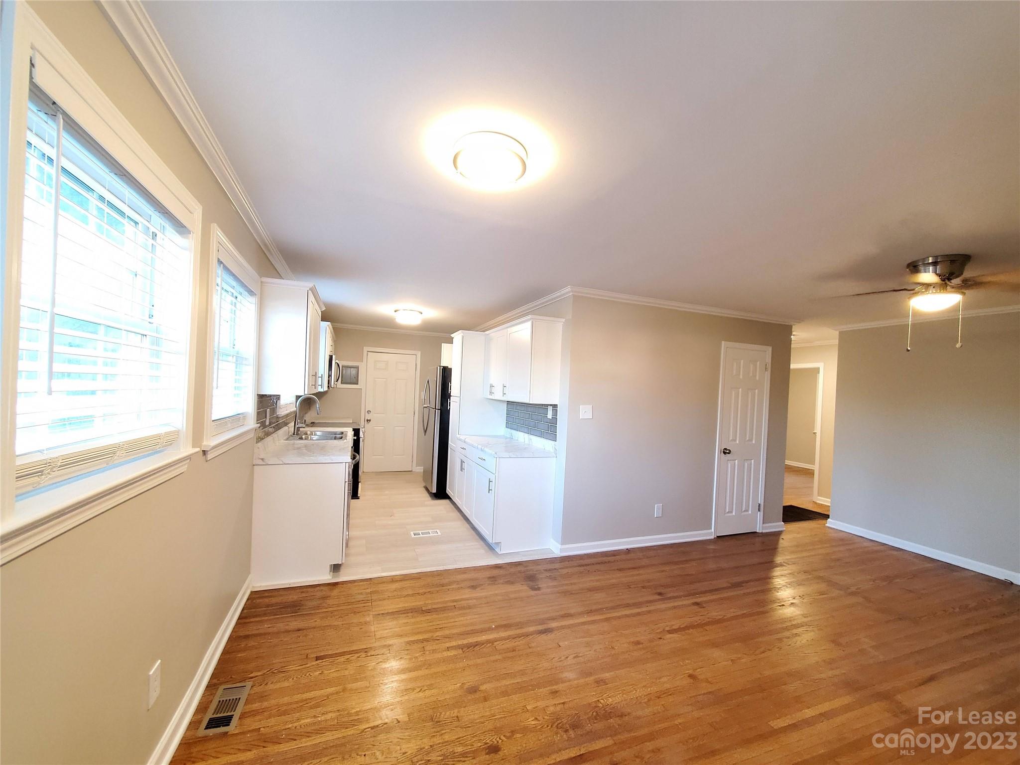 1545 Walton Road, Unit 1547 Charlotte, NC 28208 - Photo 7 of 25 a view of a kitchen with a sink and a window