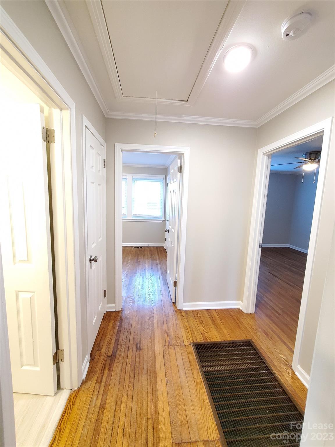 1545 Walton Road, Unit 1547 Charlotte, NC 28208 - Photo 9 of 25 a view of a room with wooden floor and staircase