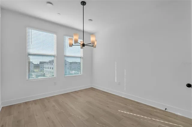 a large kitchen with stainless steel appliances kitchen island a large island in the center