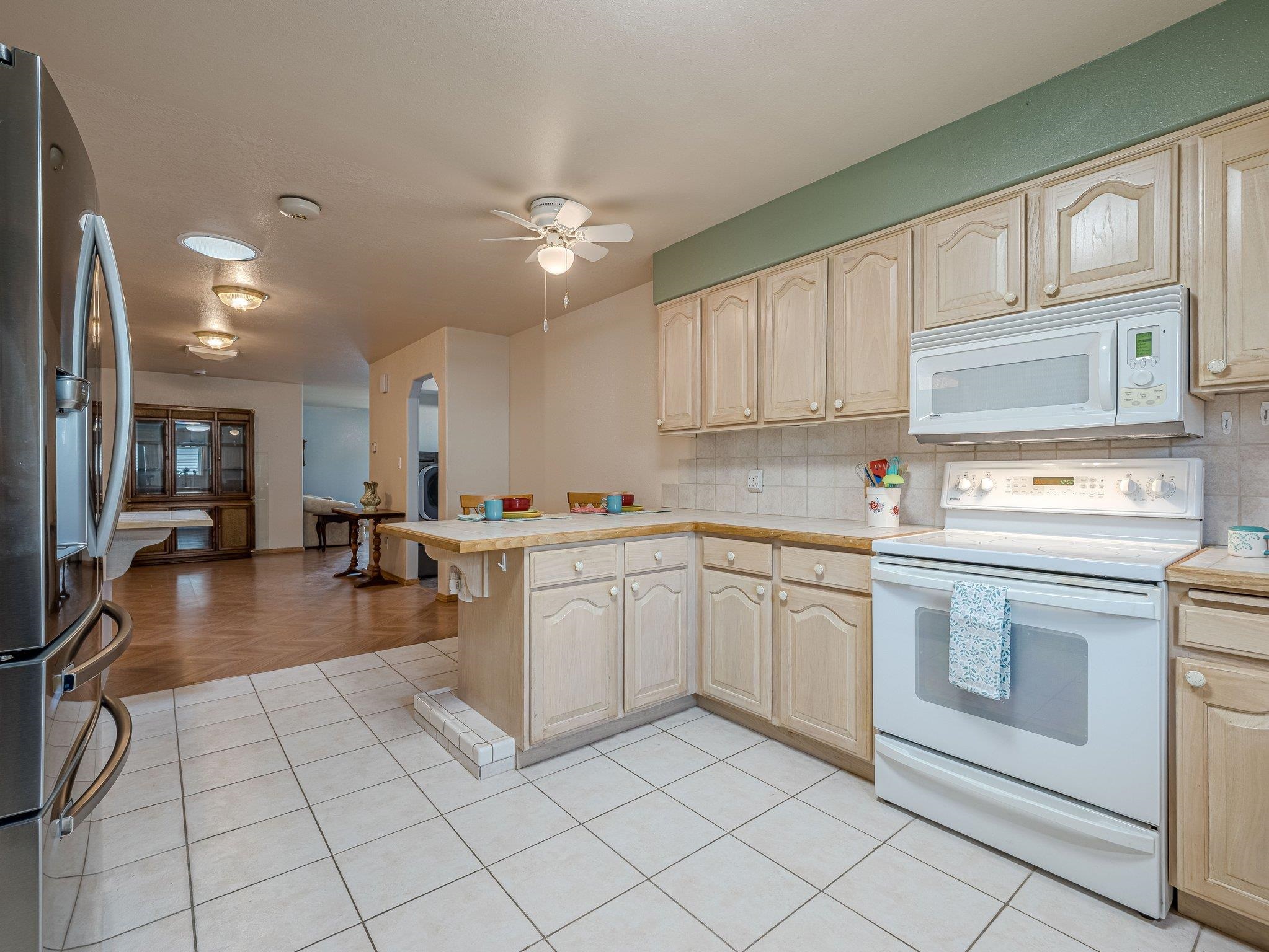 526 North Oak Street Fruita, CO 81521 - Photo 13 of 42 a kitchen with cabinets and chairs