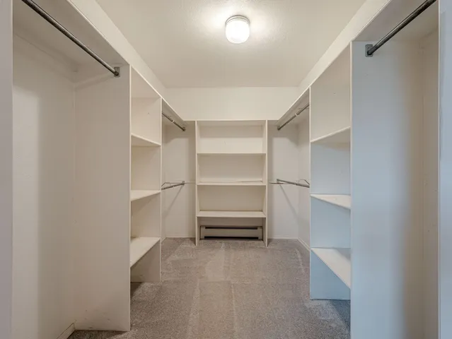 a view of an empty walk in closet