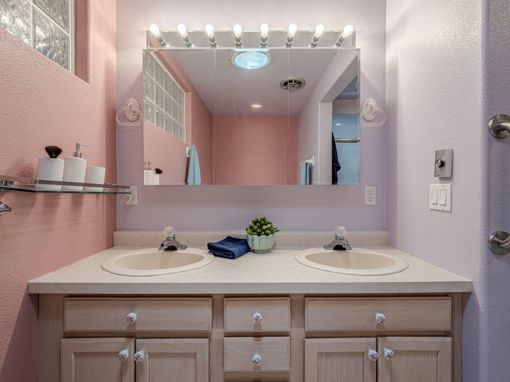 526 North Oak Street Fruita, CO 81521 - Photo 31 of 42 a bathroom with a sink and a mirror