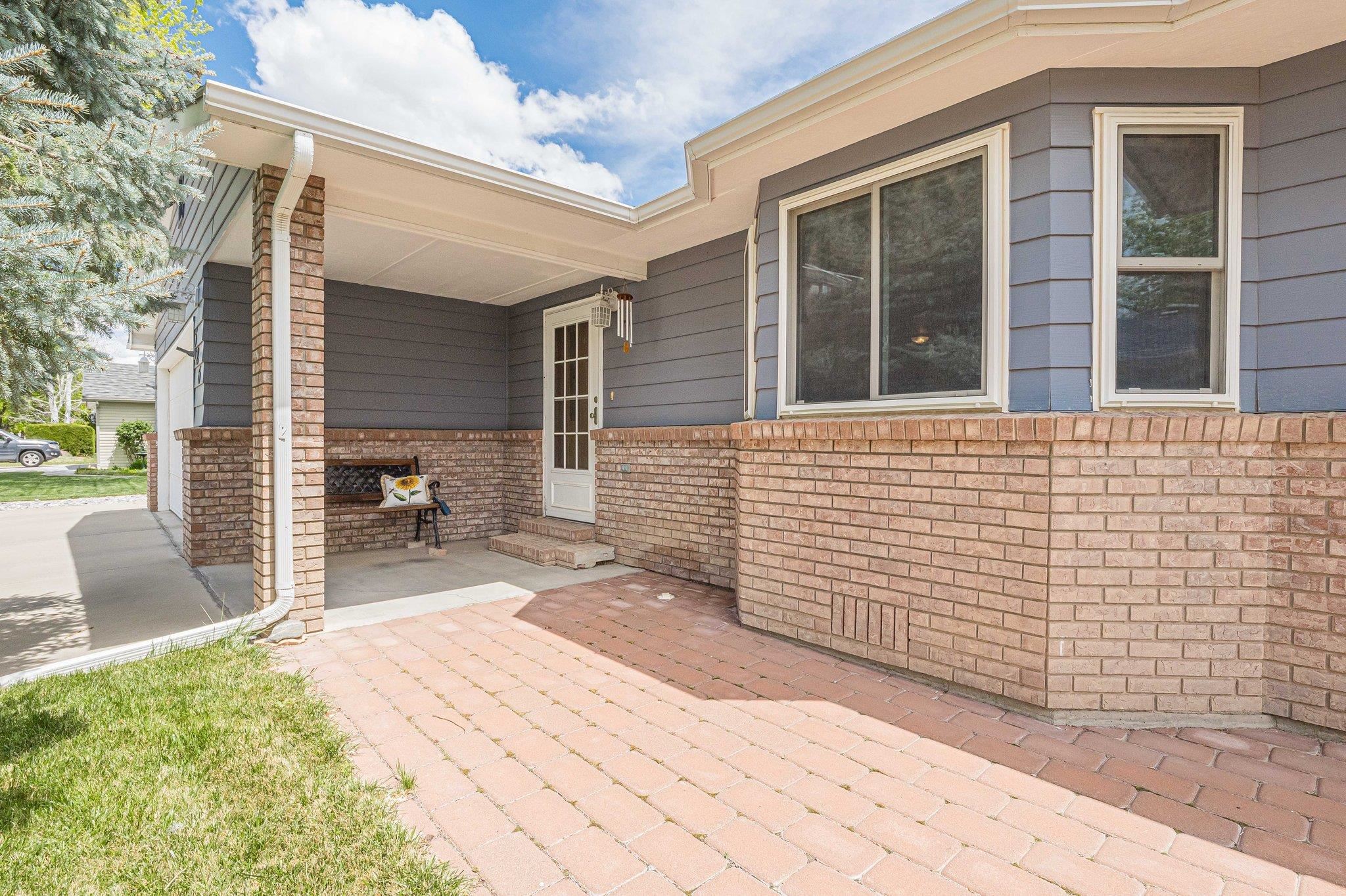526 North Oak Street Fruita, CO 81521 - Photo 4 of 42 a backyard of a house with outdoor seating