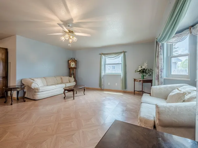 a living room with furniture and a large window