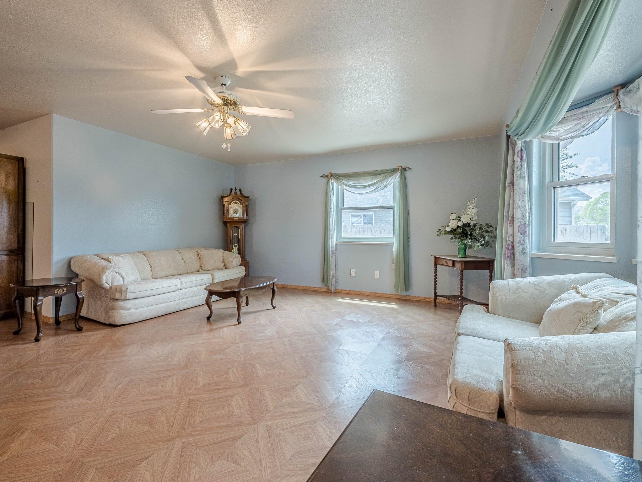 526 North Oak Street Fruita, CO 81521 - Photo 7 of 42 a living room with furniture and a large window