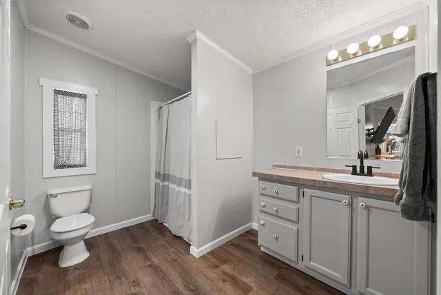 a view of walk in closet with clothes