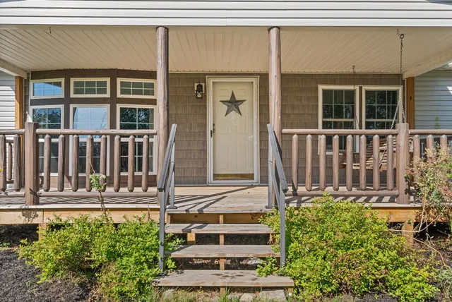 a view of kitchen with furniture and natural light