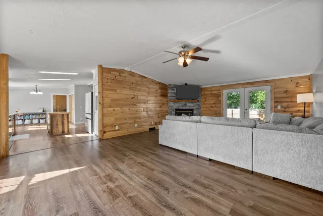 a living room with a fireplace and a flat screen tv