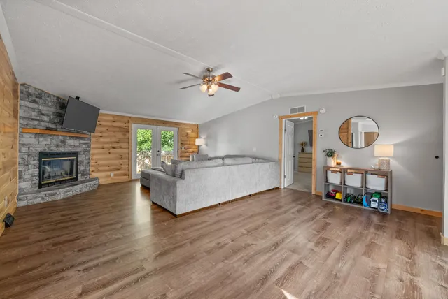 a living room with furniture and a fireplace
