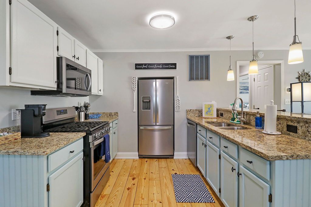 3 North Maple Avenue Fox Lake, IL 60020 - Photo 9 of 24 a kitchen with granite countertop stainless steel appliances and wooden cabinets