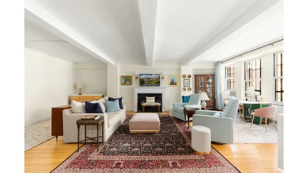 a living room with furniture couches and a fireplace