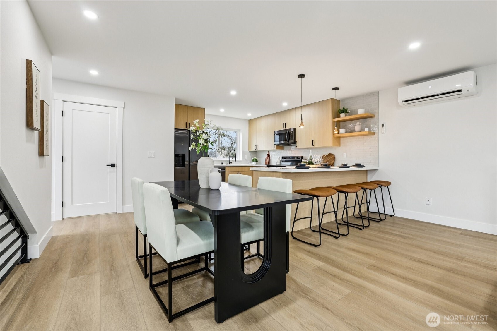 7719 Renton Avenue South, Unit B Seattle, WA 98118 - Photo 14 of 35 a view of a dining room with furniture and wooden floor