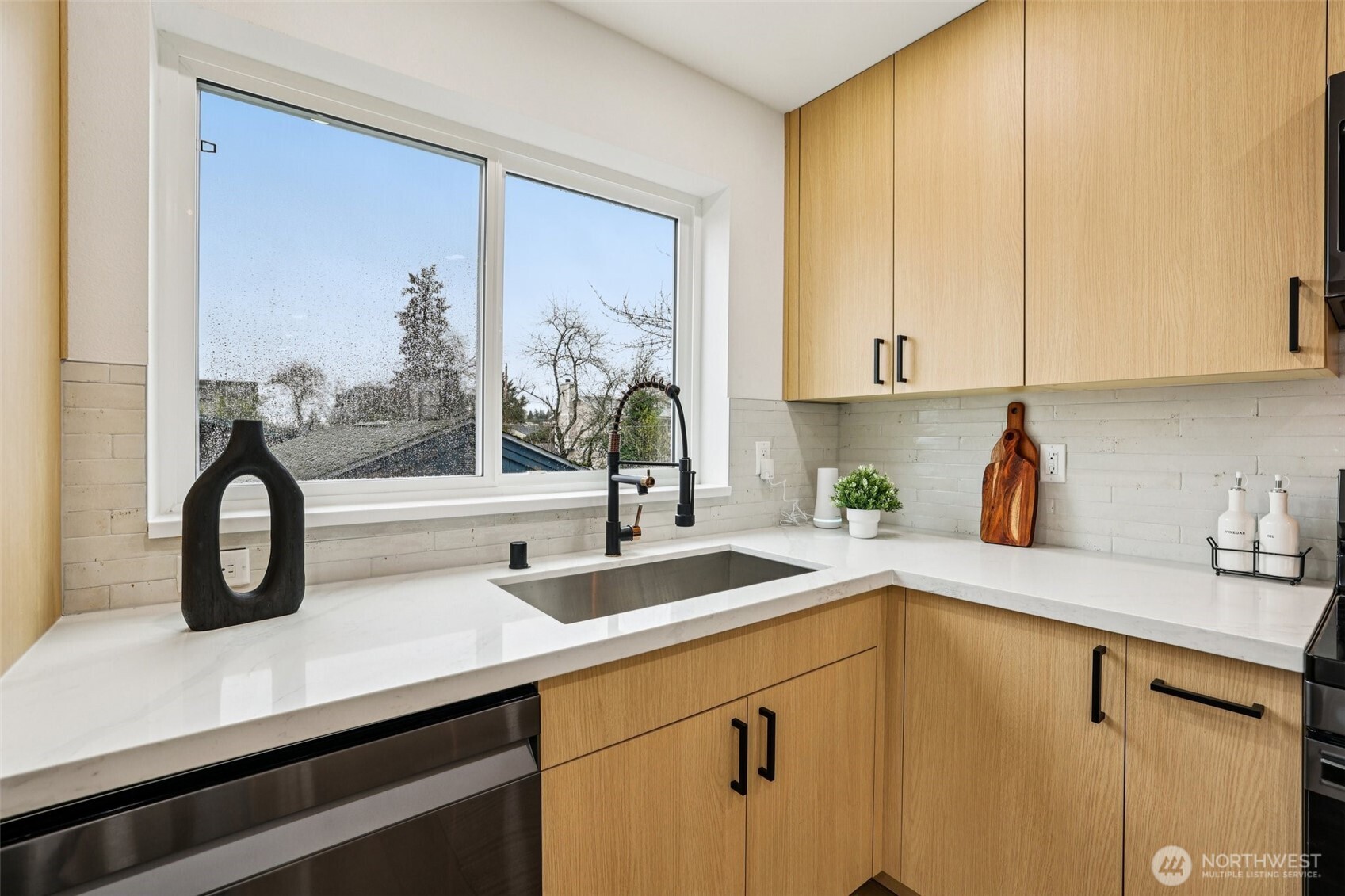 7719 Renton Avenue South, Unit B Seattle, WA 98118 - Photo 18 of 35 a kitchen with a sink and a window