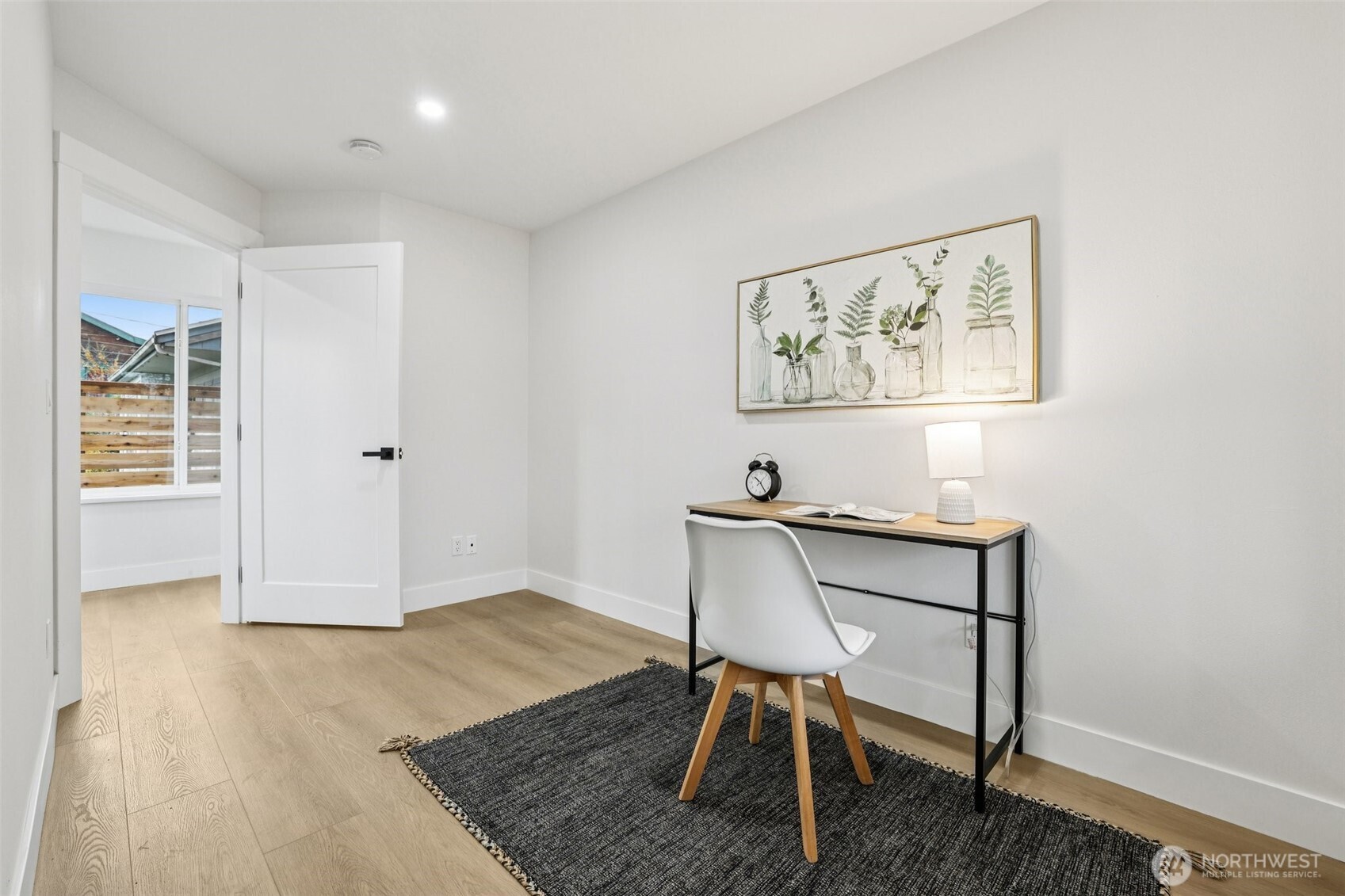 7719 Renton Avenue South, Unit B Seattle, WA 98118 - Photo 19 of 35 a view of a workspace with furniture and wooden floor