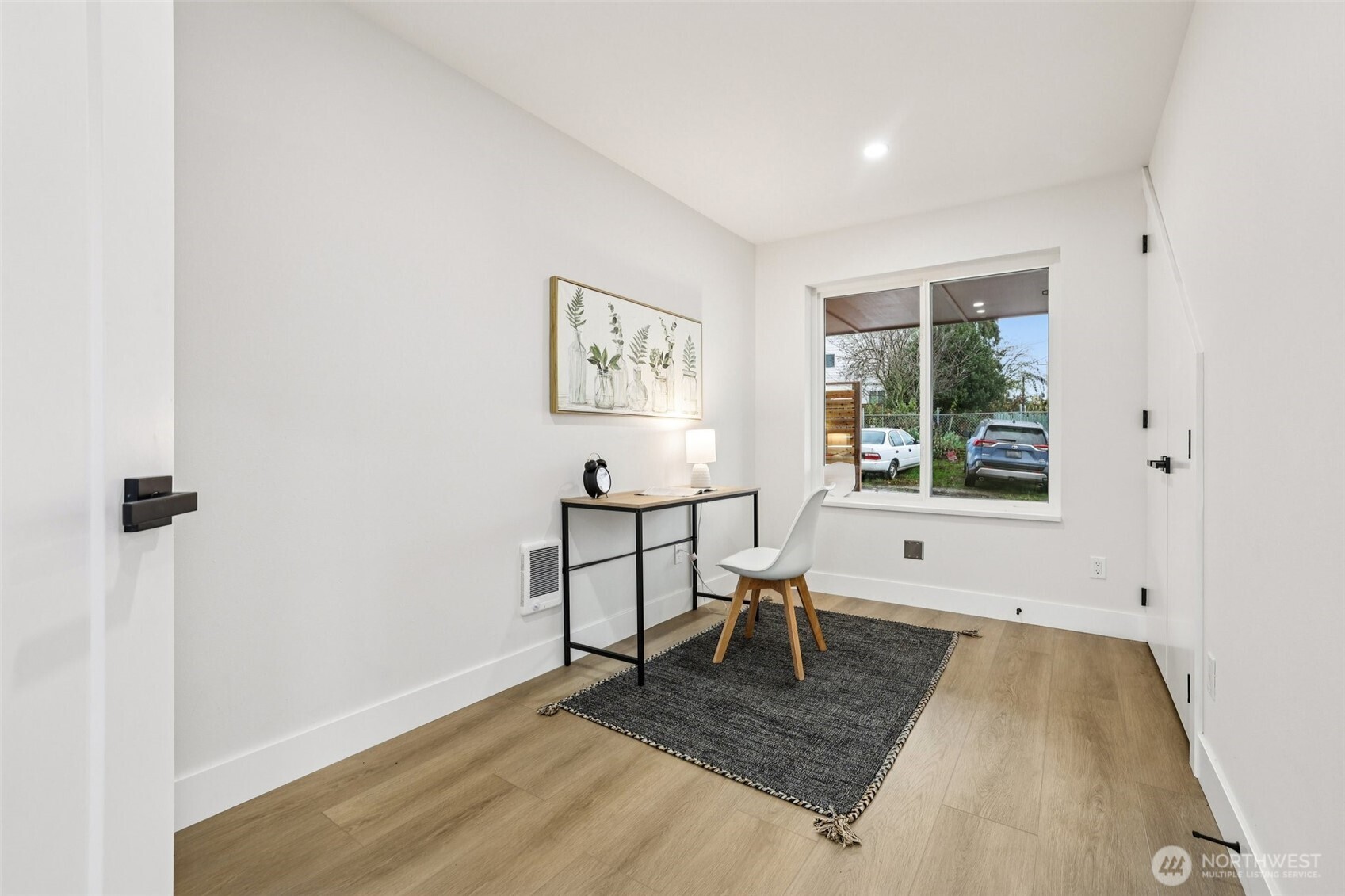 7719 Renton Avenue South, Unit B Seattle, WA 98118 - Photo 20 of 35 an entryway view with wooden floor and a rug