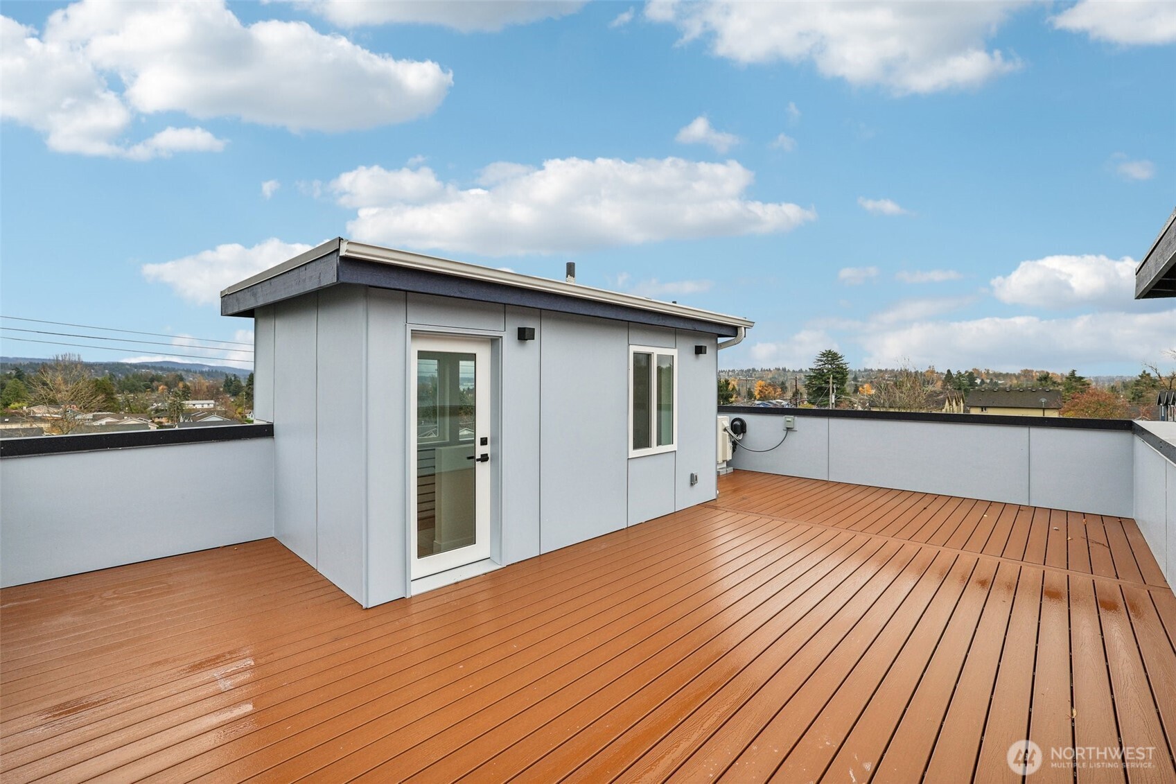 7719 Renton Avenue South, Unit B Seattle, WA 98118 - Photo 32 of 35 a view of a terrace with wooden floor