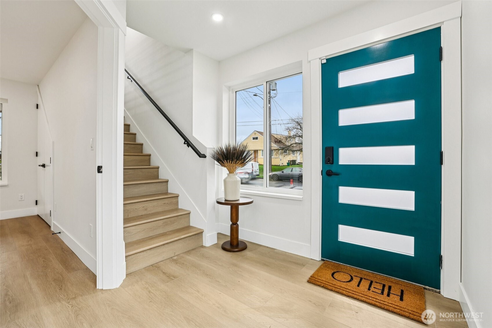 7719 Renton Avenue South, Unit B Seattle, WA 98118 - Photo 7 of 35 a view of a room with stairs and a window