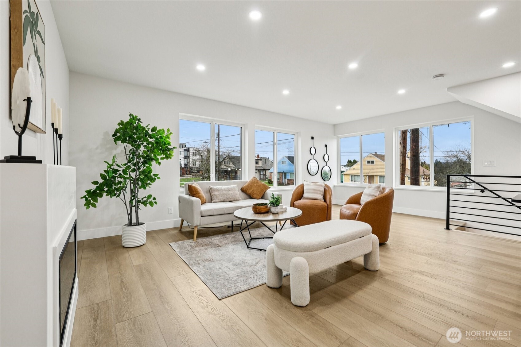 7719 Renton Avenue South, Unit B Seattle, WA 98118 - Photo 8 of 35 a living room with furniture and a wooden floor