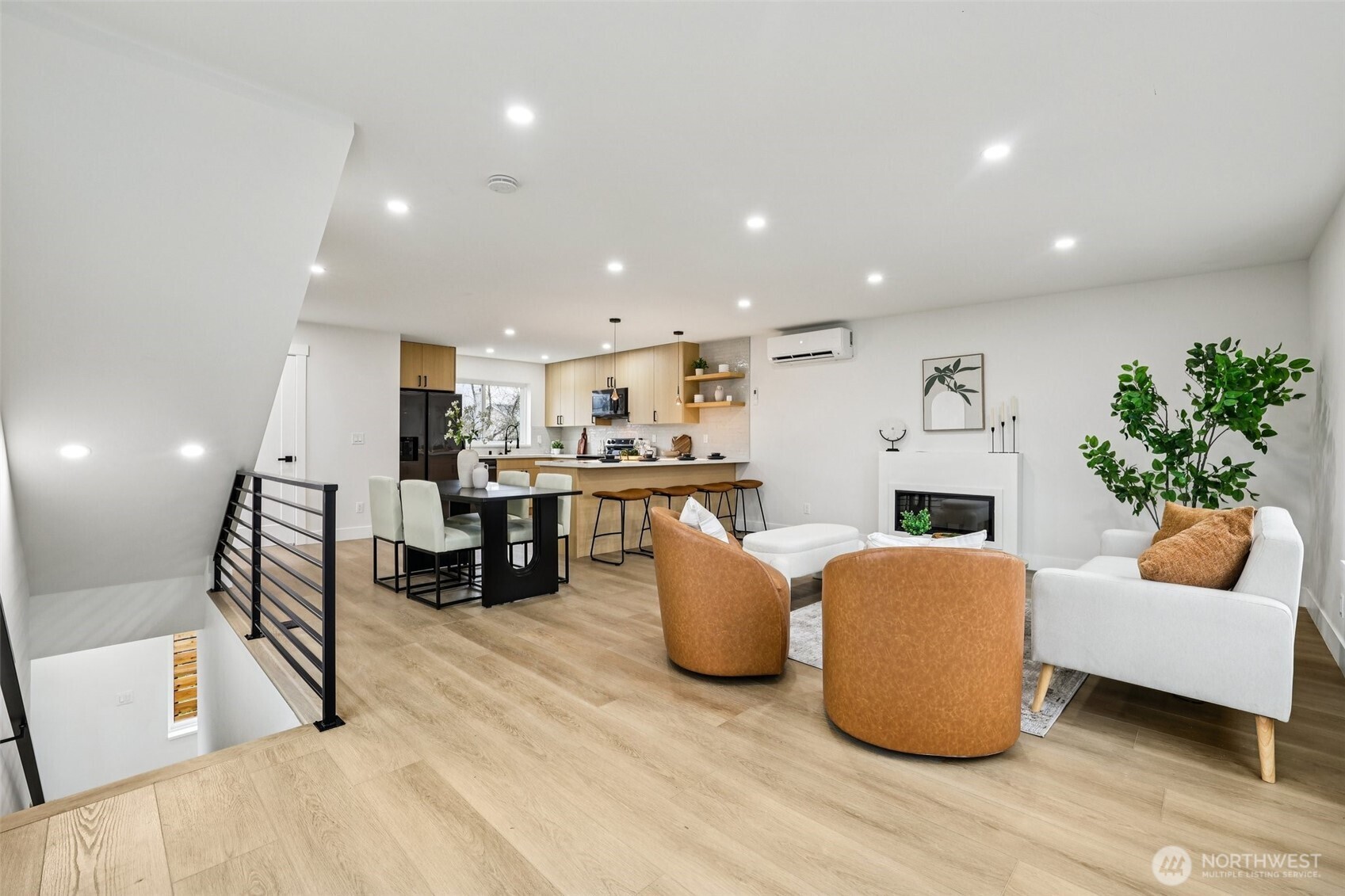 7719 Renton Avenue South, Unit B Seattle, WA 98118 - Photo 9 of 35 a living room with furniture and kitchen view