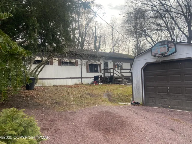 a house with trees in front of it