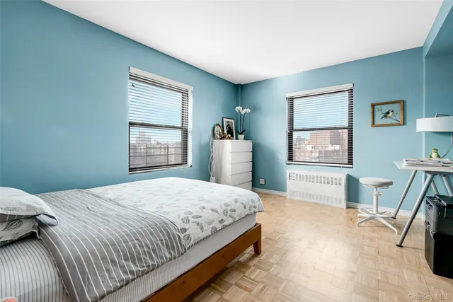 a bedroom with a bed and a chair