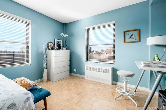 a bedroom with bed and window