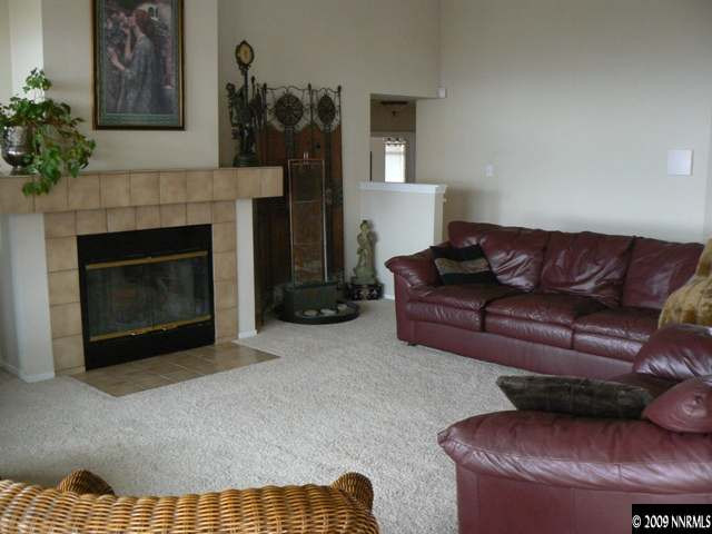905 University Place Reno, NV 89512 - Photo 5 of 9 a living room with furniture and a fireplace