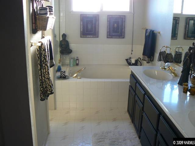 905 University Place Reno, NV 89512 - Photo 9 of 9 a bathroom with a sink and a tub