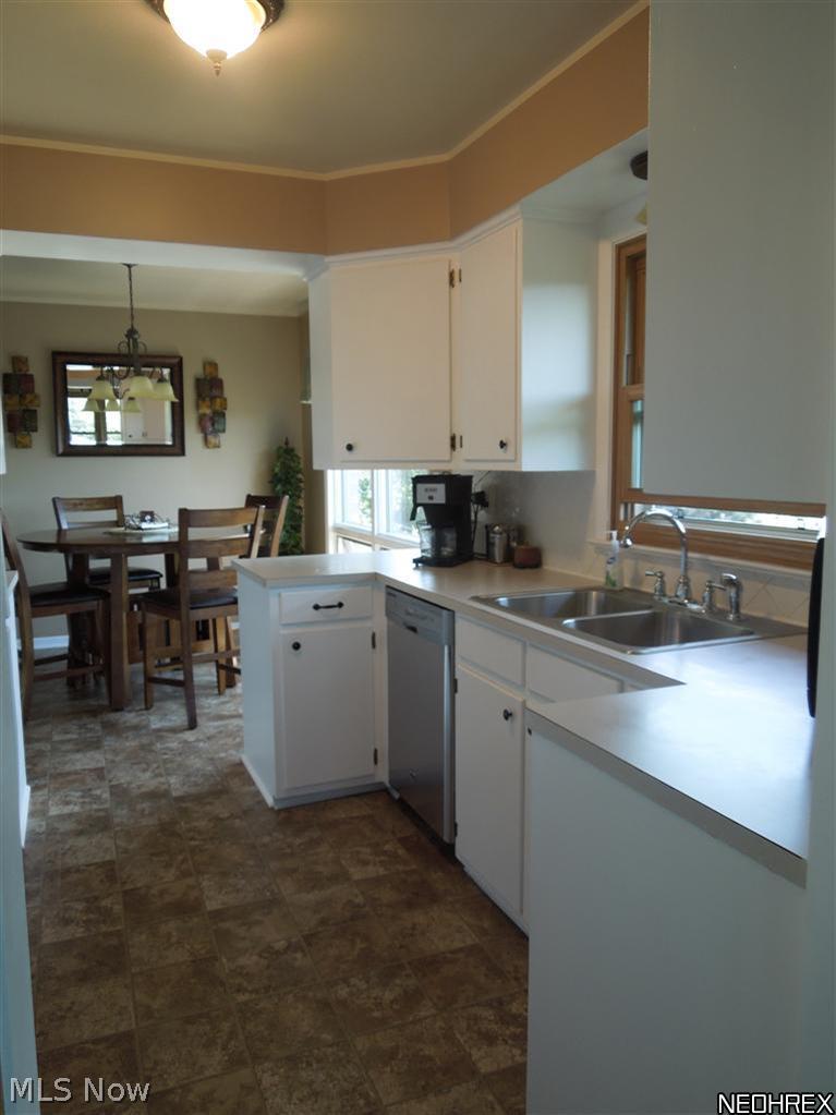 4604 5th Street Northwest Canton, OH 44708 - Photo 8 of 25 The kitchen features a stainless Maytag dishwasher purchased in October 2011, new vinyl flooring, a stainless steel sink, oven/range and refrigerator!!