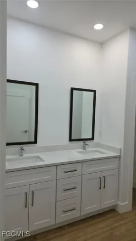 a view of walk in closet with clothes