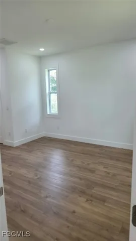 a large bathroom with a double vanity sink and a mirror