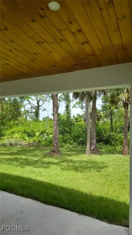 a view of a room with a yard