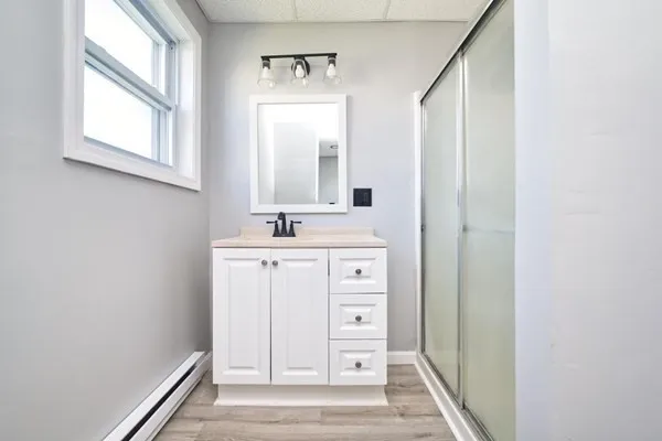 a bathroom with a sink and a mirror