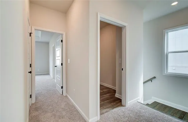a view of a livingroom from a hallway