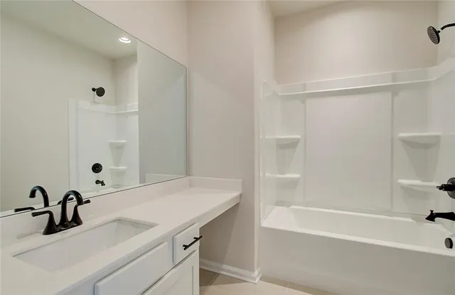 a bathroom with a sink and a bathtub