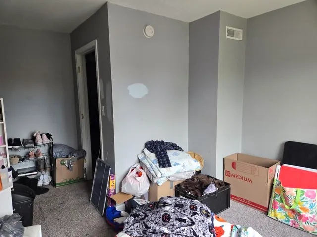 a bedroom with furniture and a window