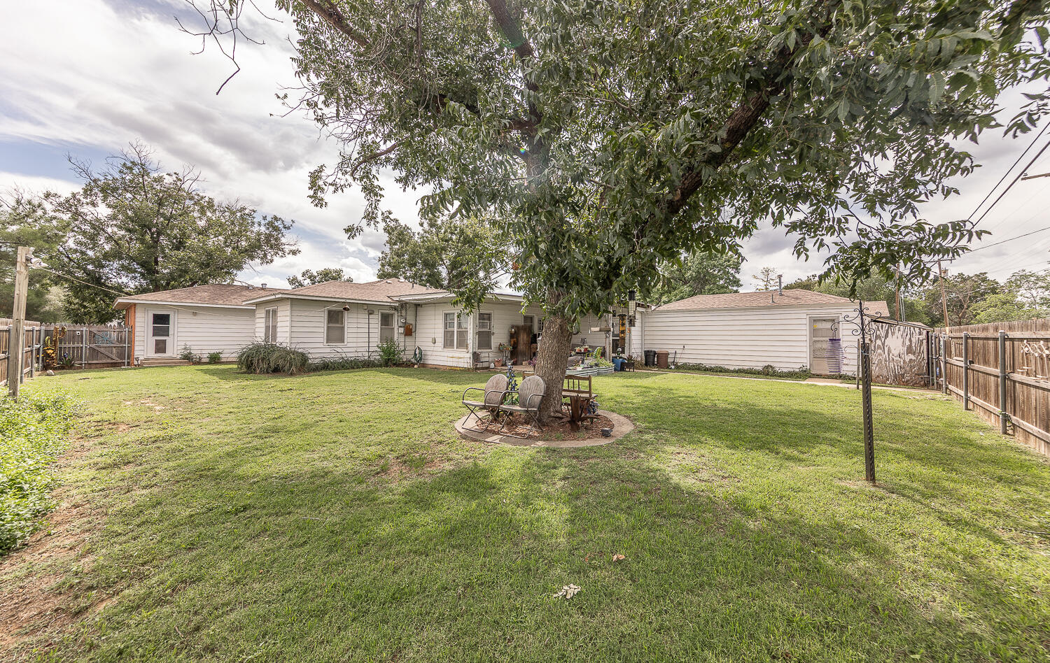 1718 28th Street Lubbock, TX 79411 - Photo 21 of 23 a front view of house with garden