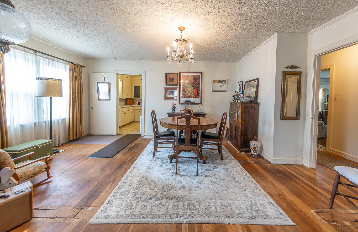 1718 28th Street Lubbock, TX 79411 - Photo 3 of 23 a view of a livingroom with furniture window and wooden floor