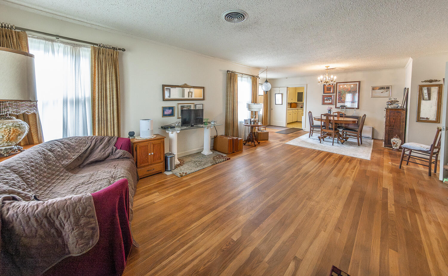 1718 28th Street Lubbock, TX 79411 - Photo 4 of 23 a living room with furniture and wooden floor