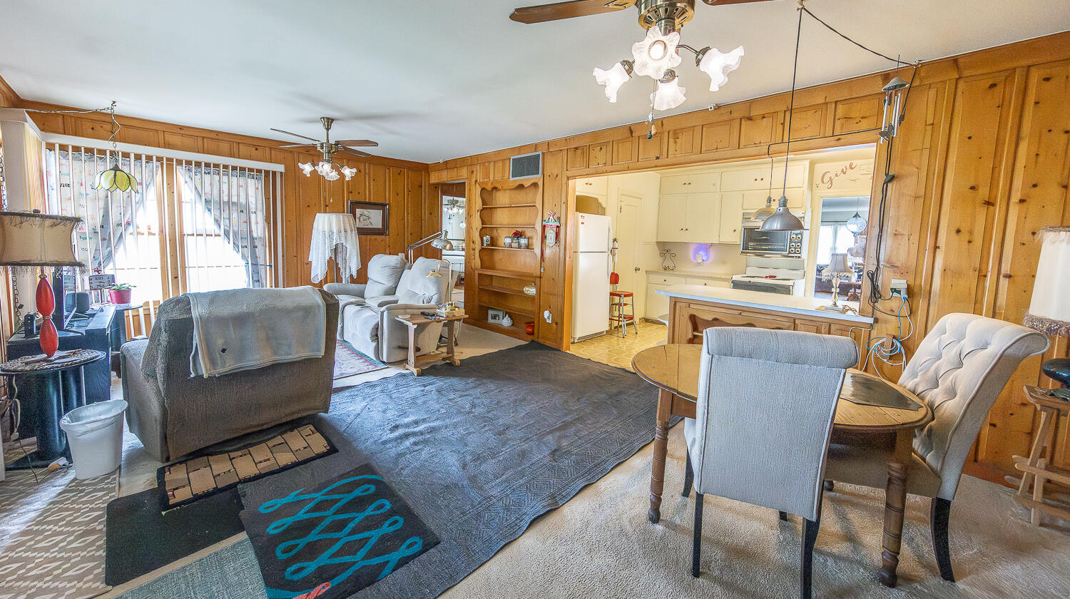 1718 28th Street Lubbock, TX 79411 - Photo 9 of 23 a living room with furniture a flat screen tv and a large window